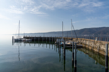 motorboats and sailboats in the old marina and harbor at Ludwigshafen on Lake Constance