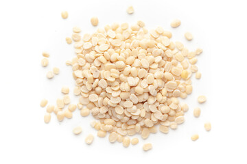 macro Close-up of Organic split polished white urad dal (Vigna mungo) cleaned on a white background. Top view