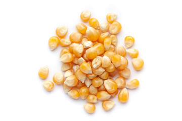 Macro Close up organic yellow corn seed or maize (Zea mays) cleaned on a white background. Top view