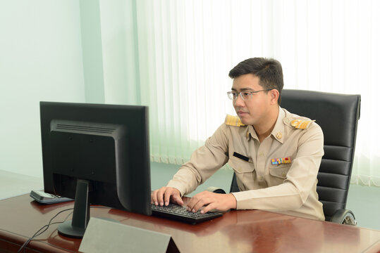 A Thai government officer, Civil servant using a personal computer in the office.