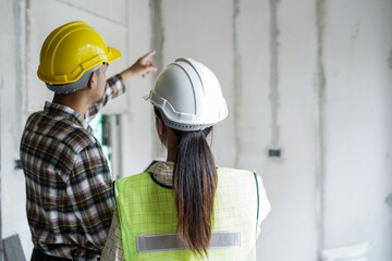 Team of worker inspector or engineers is checking inspecting and discussing plan to renovation the...