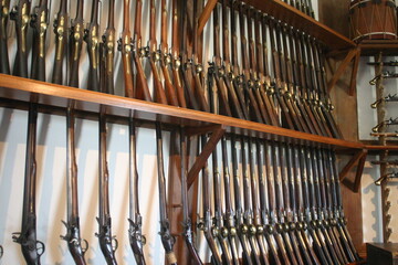 American Colonial Armory with Revolutionary Period Muskets used By American Troops to Fight the...