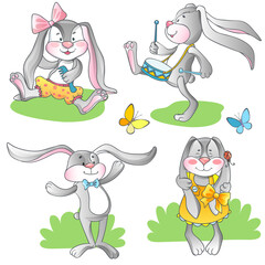 Fototapeta premium Set of cute toy rabbits with bows and butterflies.