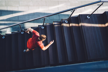 Anonymous athletic man running upstairs during training