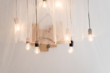 Glowing incandescent light bulbs element of decoration in an interior photo studio