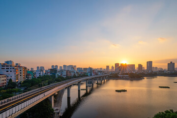 Fototapeta premium Aerial skyline view of Hanoi at Hoang Cau lake. Hanoi cityscape by sunset period