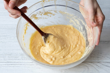 Female hands kneading muffin dough, homemade baking recipe