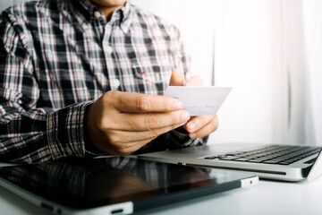 businesswoman hand using smart phone,mobile p payments online shopping,omni channel,digital tablet docking keyboard computer at office in sun light
