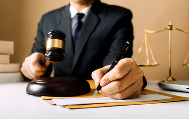 Business and lawyers discussing contract papers with brass scale on desk in office. Law, legal services, advice, justice and law concept picture with film grain effect