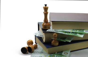 Obraz na płótnie Canvas Abstract photo with books, paper euro and chess pieces isolated on white background