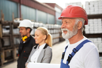 Colleagues working together. Arhitect and workers in factory