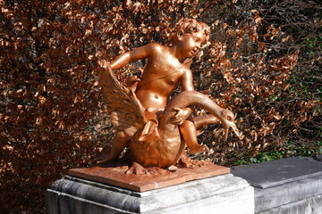 Bronze statue of a boy with a swan