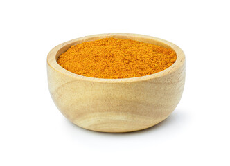 Turmeric or tumeric powder in wooden bowl isolated on white background. Clipping path.