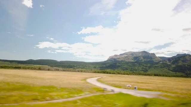 WATERTON, AB, CANADA - JULY 2019: Smooth & cinematic gimbal driving views of Waterton National Park Environment