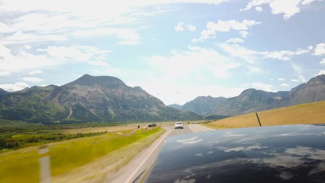 WATERTON, AB, CANADA - JULY 2019: Smooth & cinematic gimbal driving views of Waterton National Park Environment