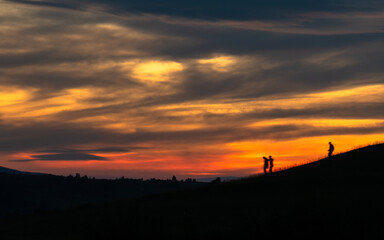 Fototapeta na wymiar silhouette of a person walking on a hill