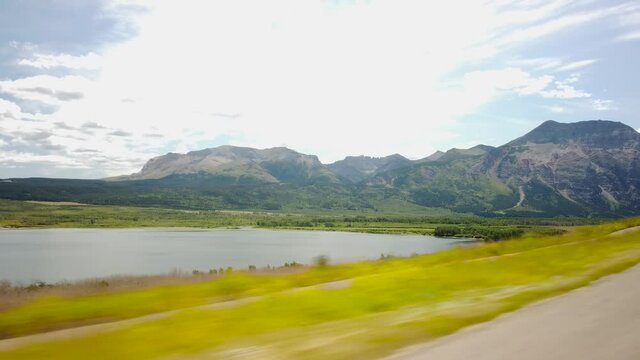 WATERTON, AB, CANADA - JULY 2019: Smooth & cinematic gimbal driving views of Waterton National Park Environment