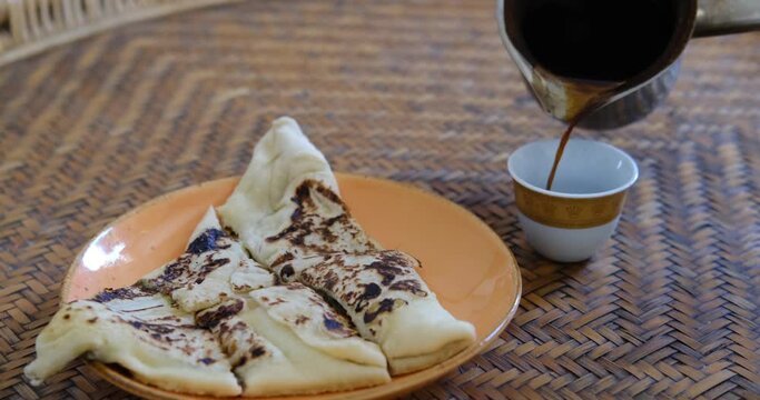 Arabic coffee and Middle eastern fatayer stuffed pie. Traditional food