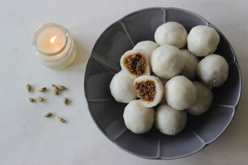 Steamed dumplings made with rice flour dough and stuffed with a filling of coconut and jaggery prepared by Kerala Christians on the Saturday prior to Palm Sunday.