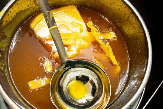 make wax base for honey bee rebuilding., natural beewax and a piece of honey cell