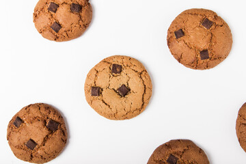 Chocolate chip cookies with chocolate pieces. On white background. Top view. Food pattern