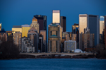 Calgary's skyline along the Bow River in the morning.