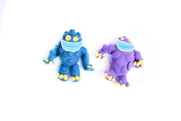 Obraz premium Hand made figurines, funny creatures made of plastic mass, modeling clay. Fancy, colorful characters.