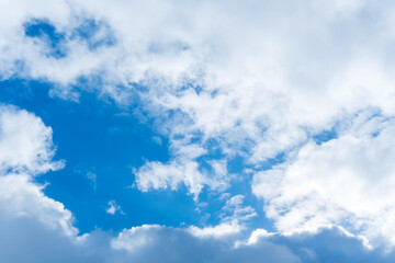 Naklejka na ściany i meble natural cloudscape on blue sky. Floating clouds with blue sky background. Blue sky copy space for text