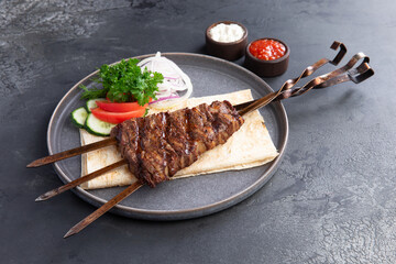 Platter of kebabs. Uch-panzha of lamb