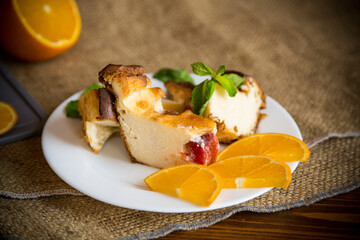 Sweet curd casserole with fruits in a plate