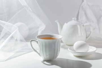 Obraz na płótnie Canvas Picture with a porcelain cup.