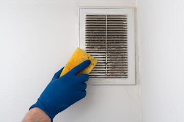 Cleaning and washing dirty hood. A lot of dust on the hood grate.