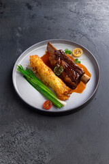 Meat on the bone, amlet and herbs