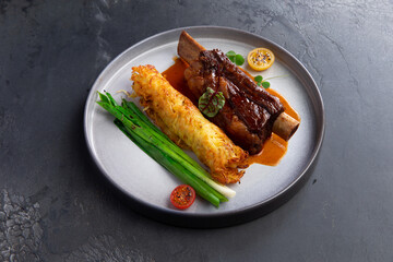 Meat on the bone, amlet and herbs