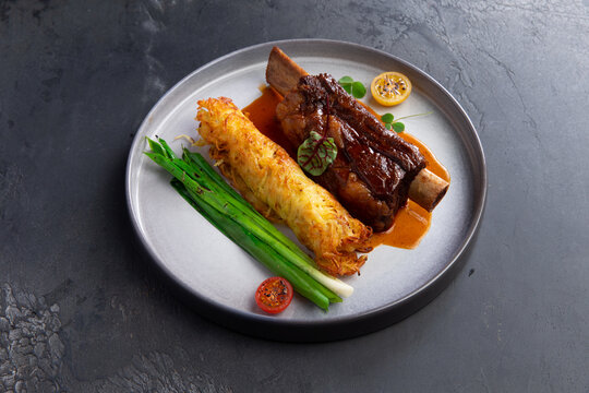 Meat on the bone, amlet and herbs