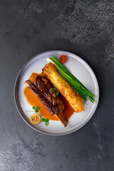 Meat on the bone, amlet and herbs