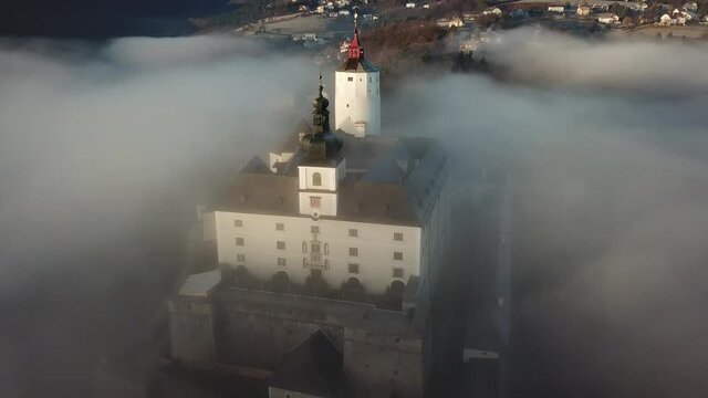 Cinematic aerial drone footage of the charming historical quaint old medieval European Burg Forchtenstein Castle from above in Burgenland Austria
