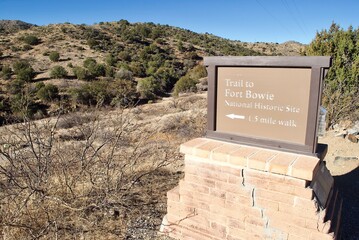 Sign from the parking area directs visitors to Fort Bowie National Historical Site in Arizona. Fort Bowie was a 19th-century outpost of the United States Army. A hike is necessary to get to the site. - obrazy, fototapety, plakaty