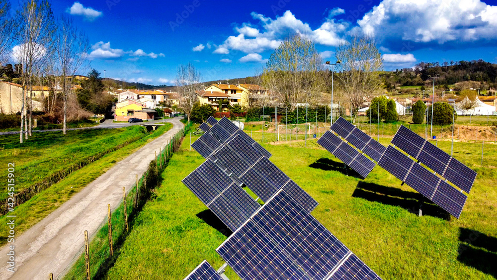 Wall mural group of modern solar panels oriented to the sun