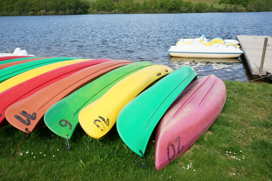 Kayaks in a row and pedal boats