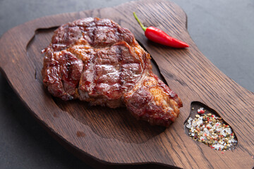 Steak on a wooden stand.