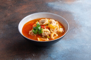 Traditional hot soup with dumplings