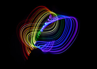 Linear strokes of lights with the colors of the rainbow. 3D illustration or 3D rendering. Gay community holiday concept.