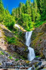Fototapeta na wymiar Beautiful waterfalls along Mount Rainier mountain trail, Washington, USA