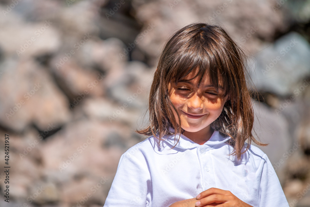 Sticker Happy young girl on a mountain trail