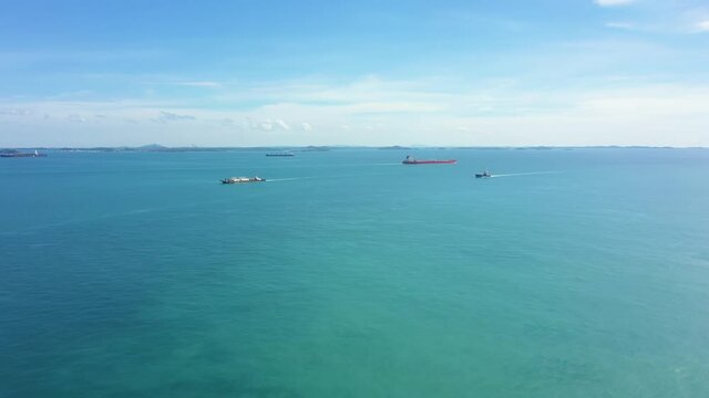 Drone shot of ships sailing the Singapore Straits