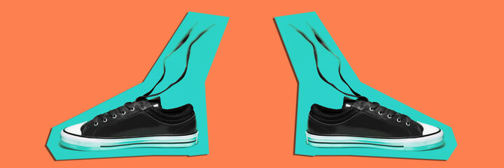 Panoramic photo of pair of shoes contoured with blue color on orange background. Artwork collage concept.