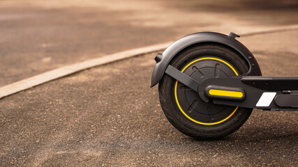 Close-up photo of the rear wheel of an electric scooter.