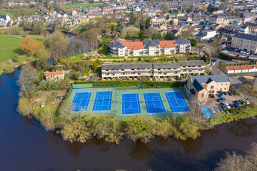 Aerial photo of the beautiful village of Wetherby in the UK showing rows of tennis courts near the river