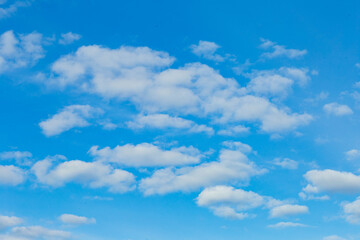 white clouds in a blue sky, taken at the end of March